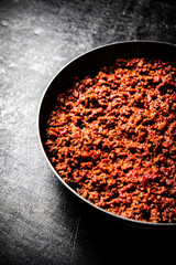 Delicious bolognese sauce in a frying pan. 