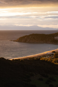 Touristic Town on the Sea Coast. Solanas, Sardinia, Italy. Colorful Sunset Sky.