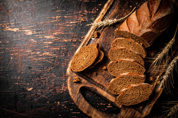 Slices of fragrant bread on a wooden cutting board.