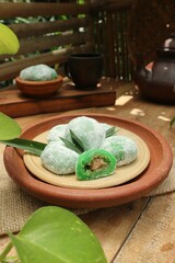 Indonesian mochi is sweet, chewy and delicious served on a clay plate