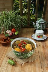 vegetable soup with ingredients and seasonings