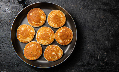 Homemade pancakes in a frying pan. 