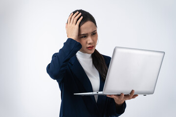 Tired Asian businesswoman in stress works holding laptop computer isolated on white background.