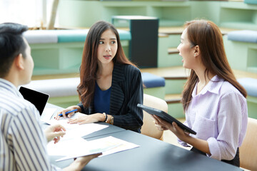 businesswoman meeting and talking about work or project with colleague in the office