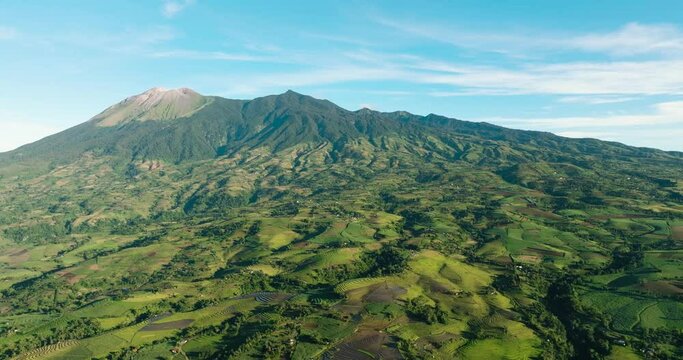 Aerial drone of Canlaon volcano and farmland on the mountain slopes. Negros, Philippines