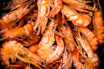 Red shrimp are boiled in water. Macro background. 