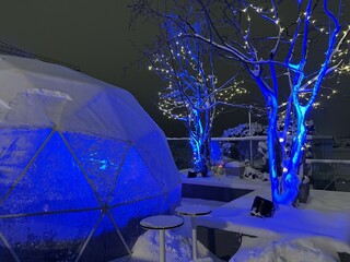 igloo set up for rooftop dining in the winter