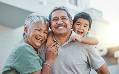 Grandparents, hug and child with smile for happy holiday or weekend break with elderly people at the house. Portrait of grandma and grandpa holding little boy on back for fun playful summer together