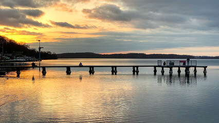 Fototapeta na wymiar Pier on the lake at sunset