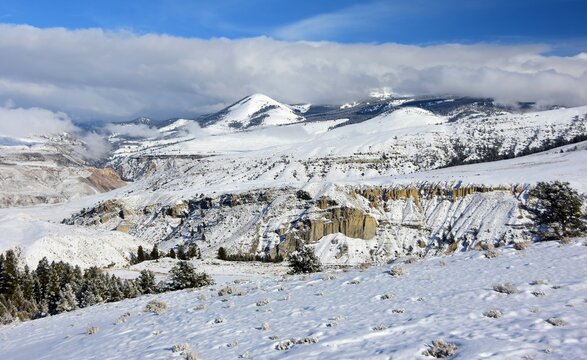 beautiful view of the  absaroka mountain range and gardner canyon on a sunny winter day along the  old gardiner road in yellowstone national park, south of  gardiner, montana