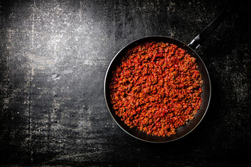 Delicious bolognese sauce in a frying pan. 