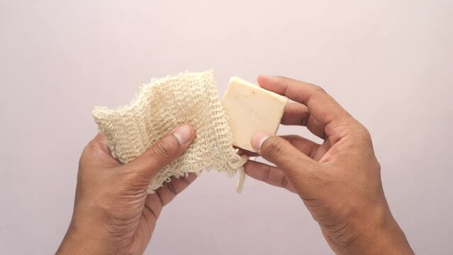 taking soap out from a soap bag 