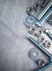 Working tool. Nuts and bolts on the table. 