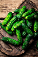 Fresh cucumbers on a cutting board. 