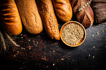 Various bread with grain in a bowl on the table. 