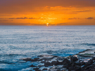 Sunrise at the seaside with clouds