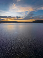 After the rain sunrise waterscape with clouds