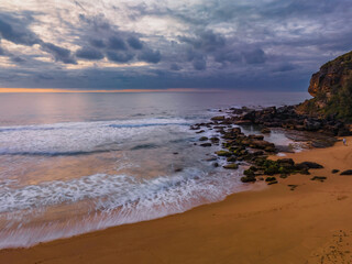 Soft sunrise seascape with clouds and colour on the horizon