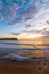 Sunrise at the seaside with clouds