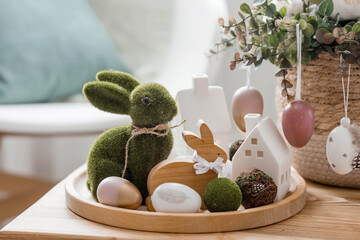 A beautiful postcard. The concept of the Bright Easter holiday. Flowers, rabbits, Easter eggs and...