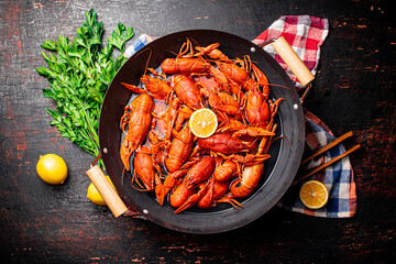 A pot of boiled crayfish on a napkin. 