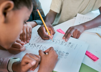 School, children and hands writing for teamwork with learning activity in classroom group together. Young kids and students working on literacy and academic exercises for development at desk.