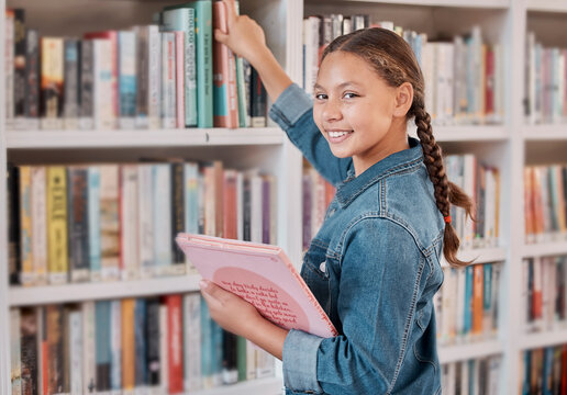 Books, happy or girl in a library to search for knowledge or development for learning growth. High school, portrait or scholarship student searching, studying or reaching for education or information