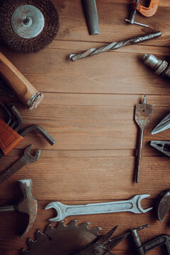 grungy old tools on a wooden background (processing cross-process)