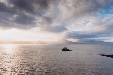 Aerial panorama view of the historic Fenit Lighthouse in Tralee Bay, beautiful clouds, sunset. High quality photo