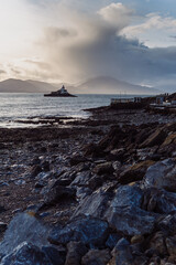 Aerial panorama view of the historic Fenit Lighthouse in Tralee Bay, beautiful clouds, sunset. High quality photo