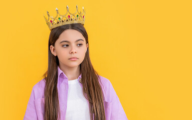 teen selfish girl with crown in studio, copy space. teen selfish girl with crown