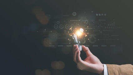 concept with innovation and inspiration, innovative technology in science concept and modern business development,creative idea,Businessman holding a light bulb showing getting new ideas