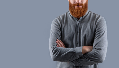 Confident man crop view with long beard. Unshaven face with red beard and mustache