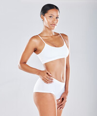 Fototapeta premium Portrait, body and woman in underwear with skin for fitness, health and wellness isolated on studio background. Diet, cellulite and exercise, healthy lifestyle mockup and weightloss with nutrition