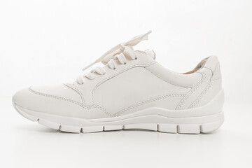 leather sneakers with lacing on a white background. 