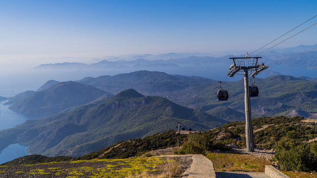 Aerial panoramic view of the stunning landscapes of Oludeniz, Turkey with cable cars at sunset