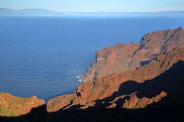 View towards the valley of Taguluche and Alojera in La Gomera, Canary Islands, Spain, in the West of the Island, with plunging cliffs and La Palma Island in the background.