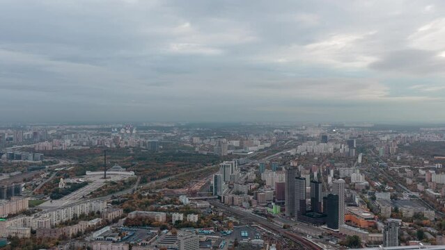 Aerial view of roads in Moscow from the high skyscraper of Moscow City. Time-lapse.