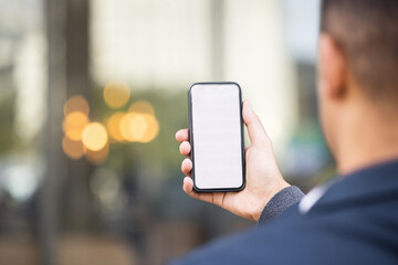 Mockup, screen or business man with phone for networking, social media or communication in London street. Search, travel or manager on smartphone for research, internet or blog content review outdoor