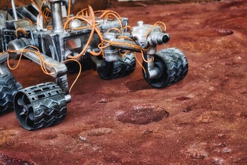 Close-up shot of Mars rover exploration vehicle on red planet surface