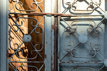 Fototapeta premium Old blue-painted wrought iron gate.