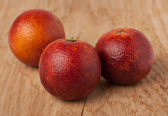 Sicilian oranges over a wooden background