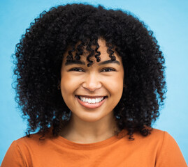 Happy, black woman or afro hairstyle portrait on isolated blue background in keratin treatment,...