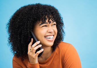 Laughing black woman, face and phone call by isolated blue background in funny gossip, news and comic story. Smile, afro and happy person talking on mobile communication technology by wall mock up