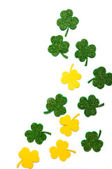 Happy St. Patrick's Day banner.Holiday background.St Patricks Day frame against a white background. Flat lay shamrocks.Copy space.Patrik's day banner