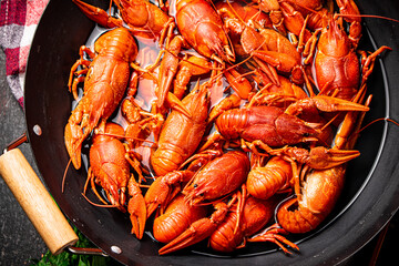 Crayfish are boiled in a saucepan. 