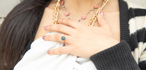 Young woman showing her engagement ring.