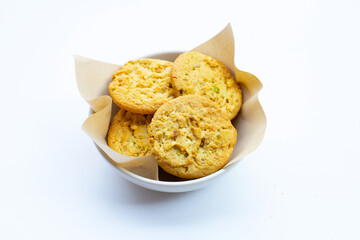 pistachio and almond cookies on white background.