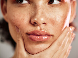 Face, freckles and woman with real skin care, thinking and makeup, cosmetics for grooming or...