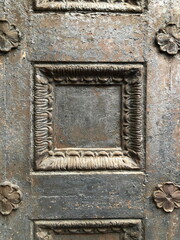 ornament on the ancient iron fortress gates shabby paint texture